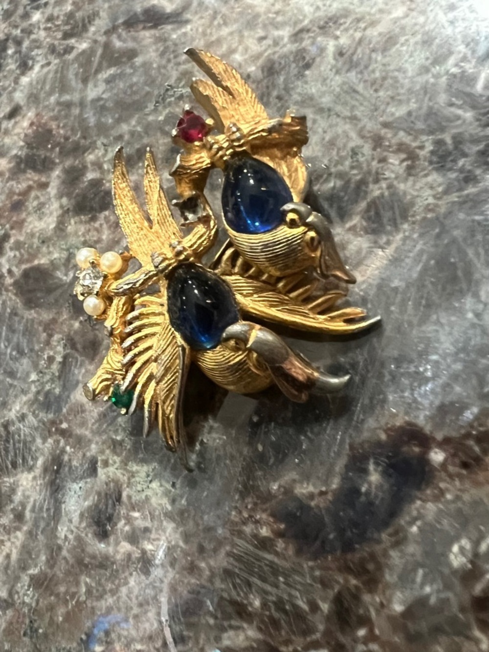 Vintage-Inspired Gold Tone Bird Brooch with Deep Blue Stones